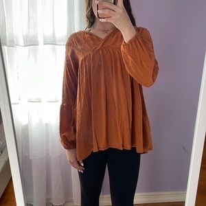 Orange blouse. Super flattering. True to size.